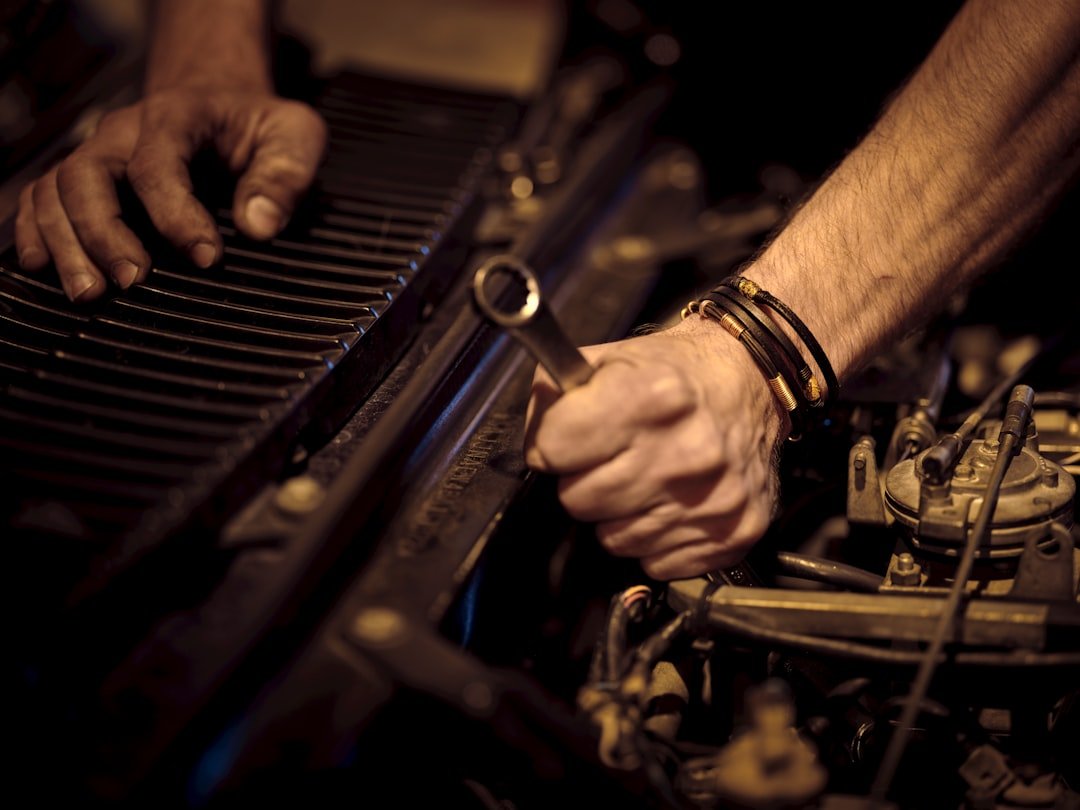 about-01 hands-working-on-car-engine-fd6osyvbtg4